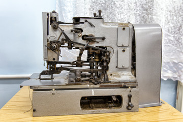 Vintage sewing machine. Workplace seamstress. Tailoring industry