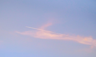 Jet Emerging From Pink Clouds