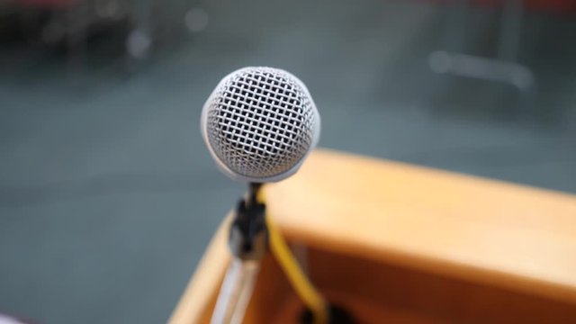 Shot of Podium Microphone. Left to right extreme close up video of microphone on the podium.