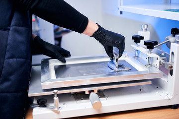 Engineer factory worker electronics works with a chip (board). Microchip Production, Nano computer Technology and manufacturing technological process
