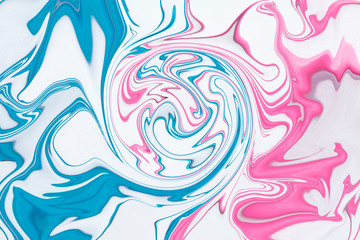Pink and blue lines of chaos are swirled in the center, background