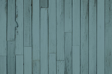 Faded blue gray reclaimed wood surface with aged boards. Wooden planks with grain and texture. 