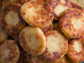 Pile of cottage cheese pancakes. Cottage cheese pancakes cheesecakes as a background