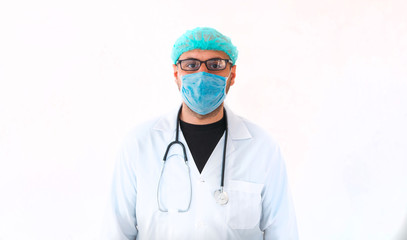 Portrait of a young male doctor in medical mask, sterile gloves and stethoscope while looking at camera on isolated white.