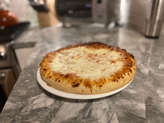 A homemade cooked pizza