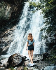 Girl at natural waterfall, Austria
