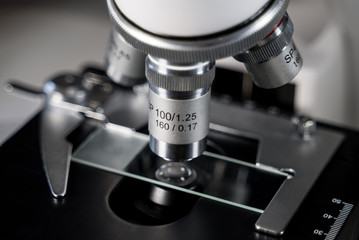 Close-up shot of Laboratory microscope with sample glass.