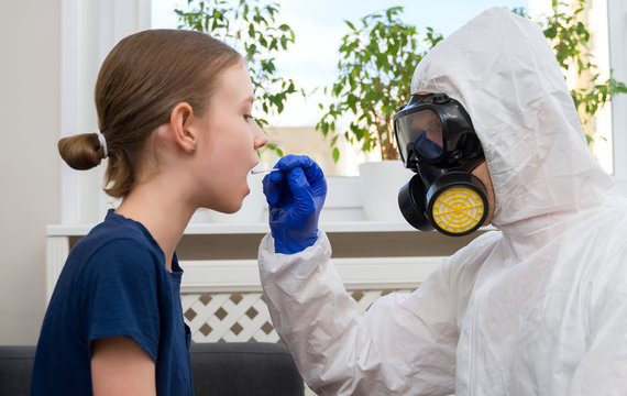 Male Doctor In Protective Suit And Mask Taking Swab Sample From Child. Coronavirus Test.