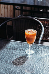 Orange iced coffee, summer cold drink in cafe on street, menu.