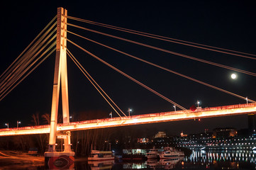 Tyumen, Russia, on April 15, 2020: The pedestrian cable-stayed bridge in Tyumen at night