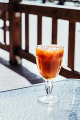 Orange iced coffee, summer cold drink in cafe on street, menu.