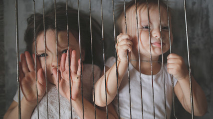 Children in a cage, domestic violence and abuse