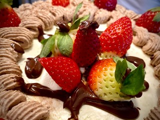 strawberries and chocolate on birthday cake