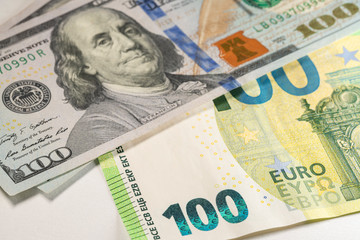 One hundred Dollar and Euro bills, Exchange Euros and Dollars. American Money and European currency