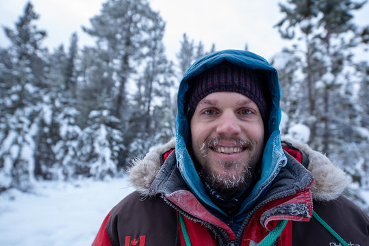 Man With Frozen Hair And Beard After Dog Sledding In Yukon Territory, Canada. Taken In The Middle Of Winter In High -20 Celsius Temperatures. 