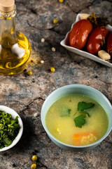 Chicken broth soup with carrot and herbs,green salad and marinated tomatoes