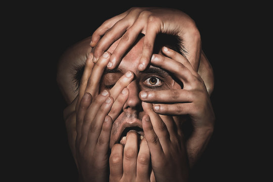 Man With Hands On Face 