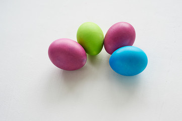 Painted multicolored eggs against a light background. Diet, protein, protein. Preparing for Easter.