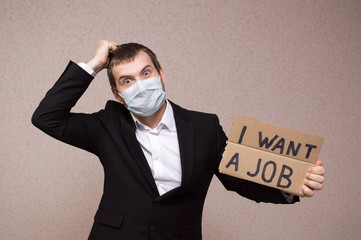 Young businessman holding sign 