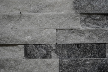 grey smoky wall coverings in the form of natural stone for facing, landscape, interior.