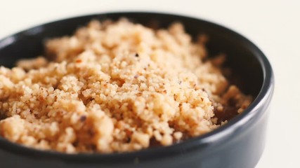 Close-up of young woman putting dough in baking form for apple crumble using her hand. Preparation of handmade domestic pie. Kitchen, pastry, desserts concept.