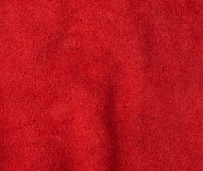Fototapeta premium texture of red suede with large fibers, bright scarlet color