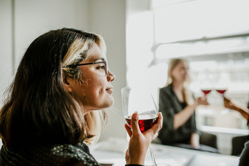 Classy businesswomen enjoying wine