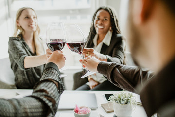 Business people celebrating with wine