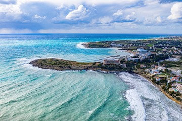 Fototapeta na wymiar Aerial drone view of Cyprus coast and sea. Peyia,