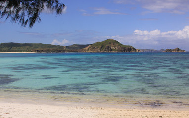 Crystal clear turquoise water Kuta beach Lombok