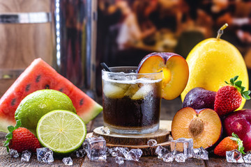 Brazilian caipirinha, typical Brazilian cocktail made with black plum, cachaça and sugar. Traditional drink from Brazil known as caipifruta, with thefts around.