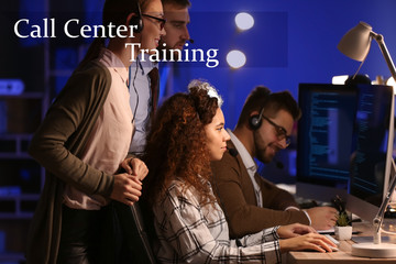 Technical support agents training in office at night