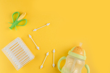 Baby, newborn child care hygiene accessories. Kid, infant health product on yellow background. concept of child care