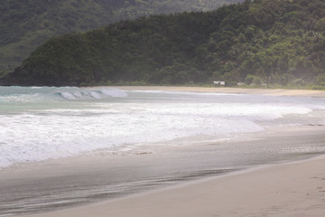 Breaking surf waves at Mawun beach Lombok