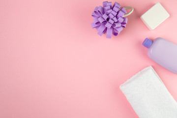Newborn child care. Hygiene accessories, and bath set on pink background.