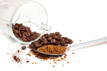 Macro shot of instant granules and beans coffee on a white