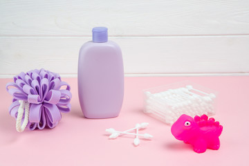 Obraz na płótnie Canvas Spa and bath concept. Baby bath set on purple background.