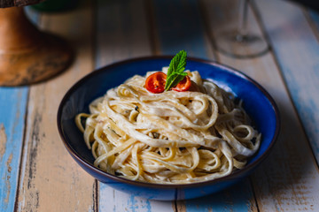 Fettuccine on table with wine and bread #3