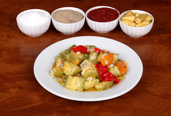 very beautiful pumpkin galve with fragrant turkish spices on white plate on wooden table