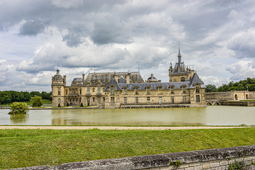 
External view of famous Chateau de Chantilly (1560) - historic chateau located in town of Chantilly. Oise, Picardie, France.