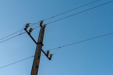 Electricity pole on blue background