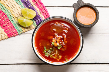 Mexican beef  birria consomme on white background