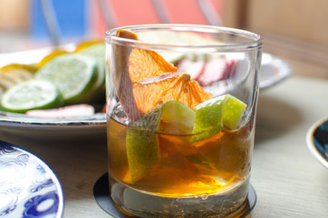 
Orange, lemon and whiskey cocktail