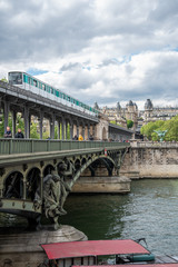 Metro passing by on Bridge Bir Hakeim, Paris/France
