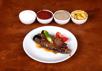 very nice cauliflower eggplant turkish spicy peppers on white plate on wooden table