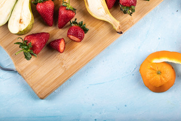 Strawberry and pears on a blue background