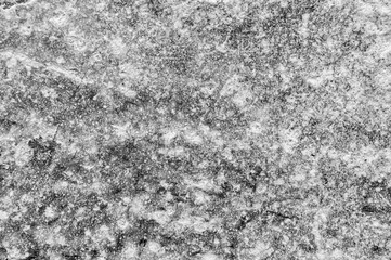 Granite natural surface. Stone texture. Stone old wall. Texture pattern. Natural stone close-up. Structural surface close-up. Soft focus on the background. Selective focus on the background.