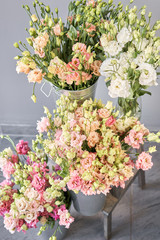 Bunches of flowers different varieties eustoma in vases. Lovely Vintage background with flowers. Wallpapers