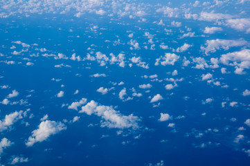 small cirrus clouds high in the blue sky