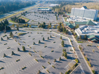 Aerial image of the abandoned parking lot at an outlet mall due to the coronavirus stay home order